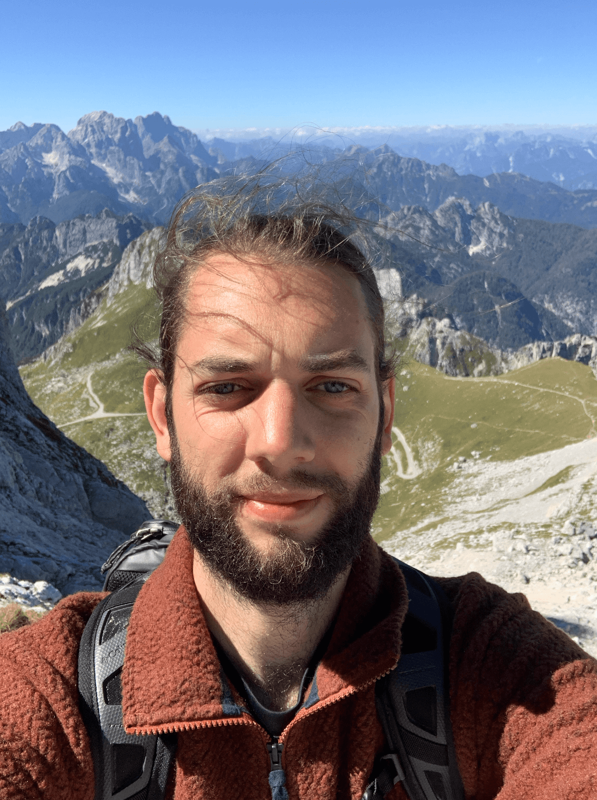 Selfie of Moritz standing in the Slovenian Alps